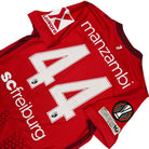 2025/26 SC Fribourg Domicile - Manzambi 44 (M) - Iconic Football Shop